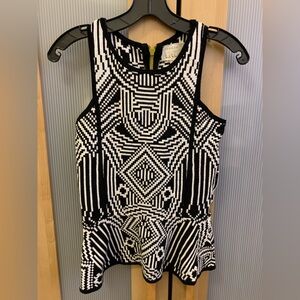 Nicole Miller knit peplum top in black and white colors Size S